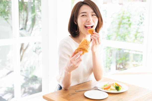 istock attractive asian woman who eats 1332939037