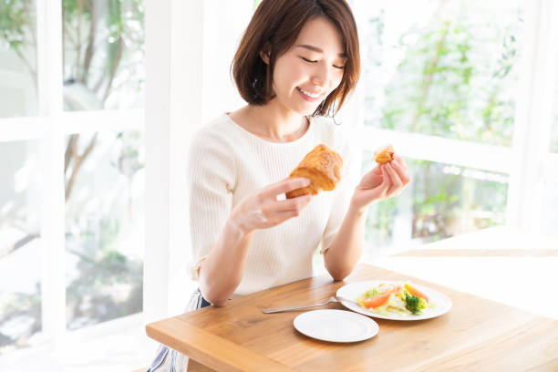 istock attractive asian woman who eats 1332939062