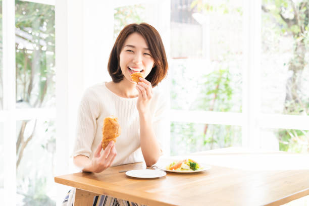 istock attractive asian woman who eats 1332939095