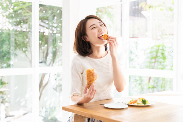 istock attractive asian woman who eats 1332939126