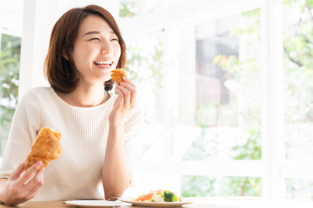 istock attractive asian woman who eats 1332939156