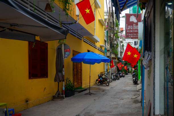 National Day in Vietnam - flag hung in front of houses in a small alley in the city of Nha Trang.  Nha Trang, Vietnam: 2020-10-13