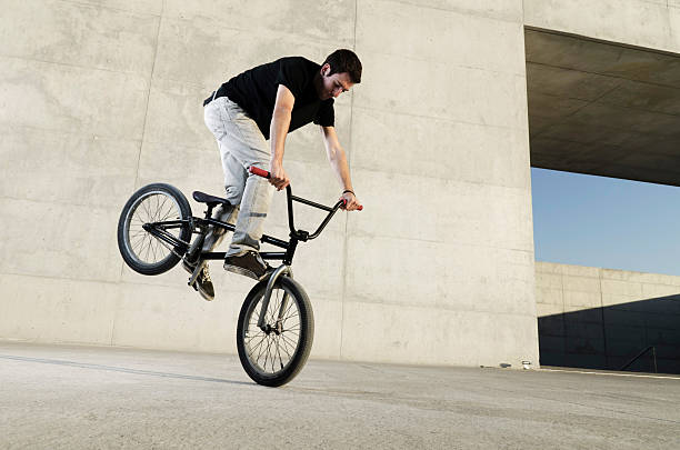 Young BMX bicycle rider stock photo