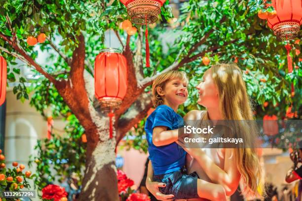Mom And Son Celebrate Chinese New Year Look At Chinese Red Lanterns Stock Photo - Download Image Now