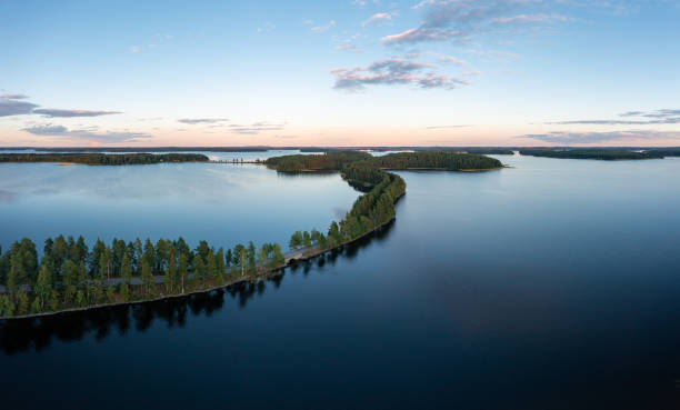 istock Beautiful ridge road between lakes in Saimaa in summer in Finland. 1332958075
