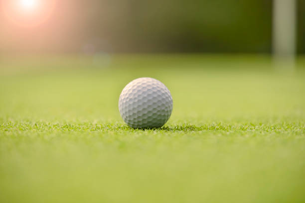 istock A well-maintained golf course green and a pure white golf ball 1332961676