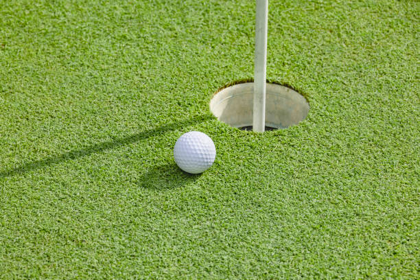 istock A well-maintained golf course green and a pure white golf ball 1332962386