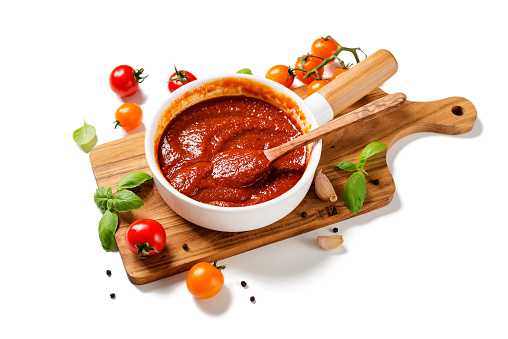Classic homemade Italian tomato sauce with basil for pasta and pizza. Isolated on white  background.