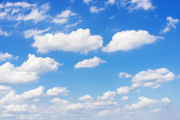 istock beautiful blue sky and white fluffy cloud horizon outdoor for background. 1332965324