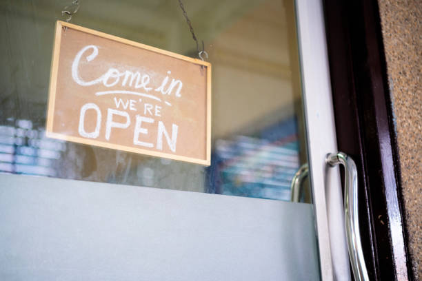 istock Come in we're open, vintage retro sign in cafe front 1332965645