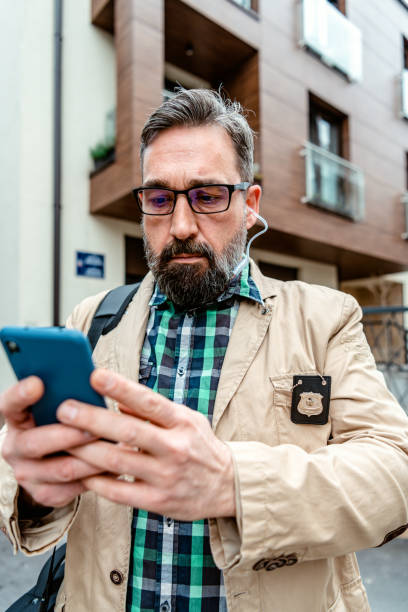 istock Detective collects important information from a mobile phone 1332969414