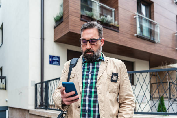 istock Detective collects important information from a mobile phone 1332969437