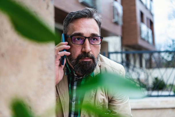 istock Detective collects important information from a mobile phone 1332969458