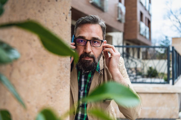 istock Detective collects important information from a mobile phone 1332969469