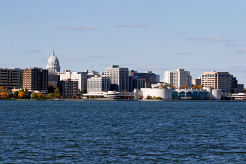 The skyline of Madison, Wisconsin including the State Capitol and the Monona Terrace.