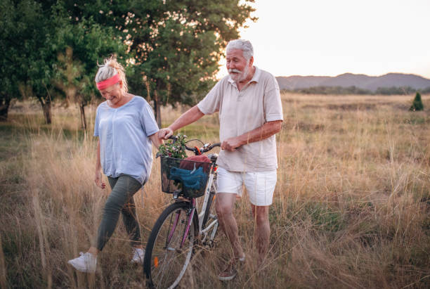 istock The senior couple pushing bicycles 1332975062
