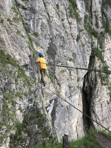 istock Man on Via Ferrata climbing up 1332975231