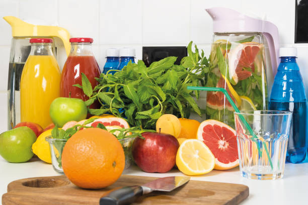 istock juices and fruits for making cocktails lie on a white table, a chef's workplace for drinks 1332978209