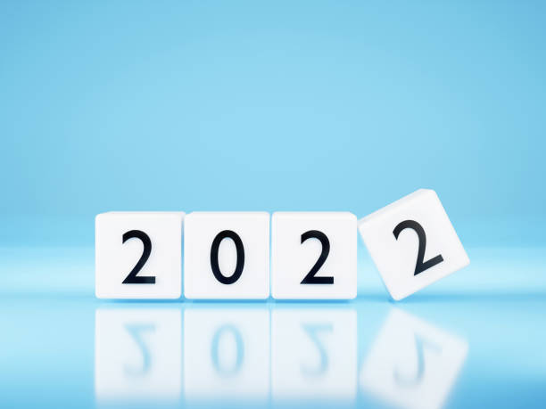 istock New year 2022 concept - white Plastic cubes on blue background. Change calendar. 3D illustration. Minimalist style counter. 1332979540