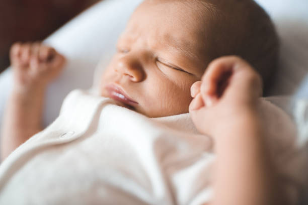istock Cute baby in bed closeup 1332979732