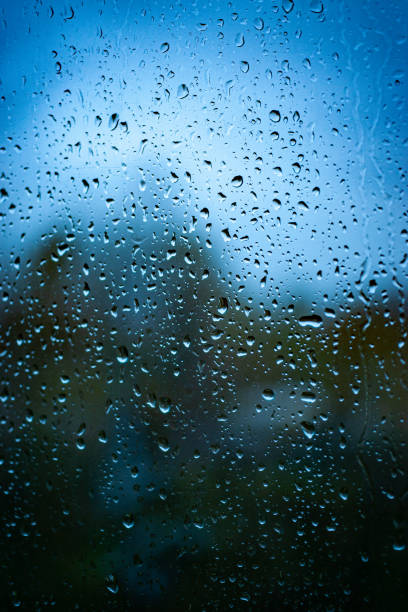 istock Raindrops on a rainy day by the window 1332983006