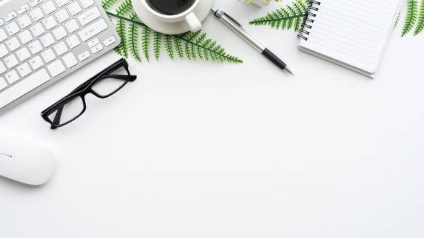 istock Top view of the white workspace at the office. Mock up. 1332985511