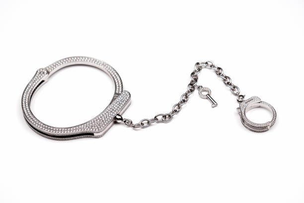 Jewelry.Gold bracelet and ring on a chain.