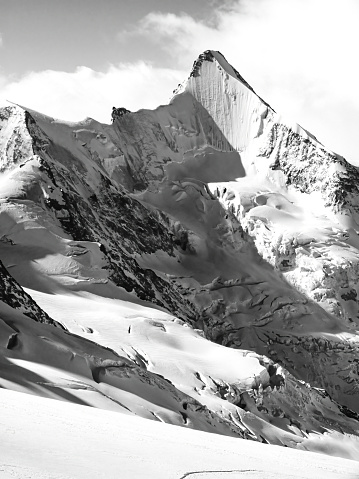 A view on the Snow capped Mountain Peak in Black and White Colors.