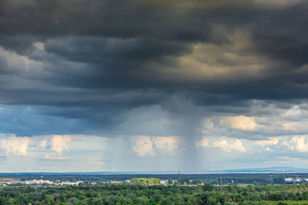 istock Image of a shower cloud with rain veil during daytime 1332996366