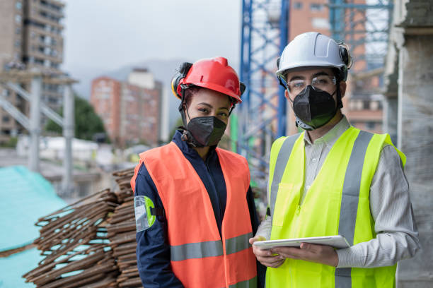 istock An engineer and a construction worker discuss issues of the work they carry out 1333001131