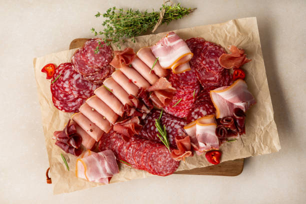 istock Overhead view of meat antipasti assorted delicatessen 1333004712