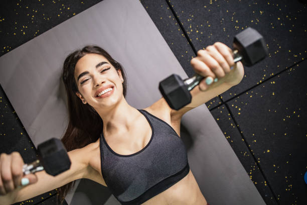 istock High angle view of a woman doing exercise with dumbbell 1333004938