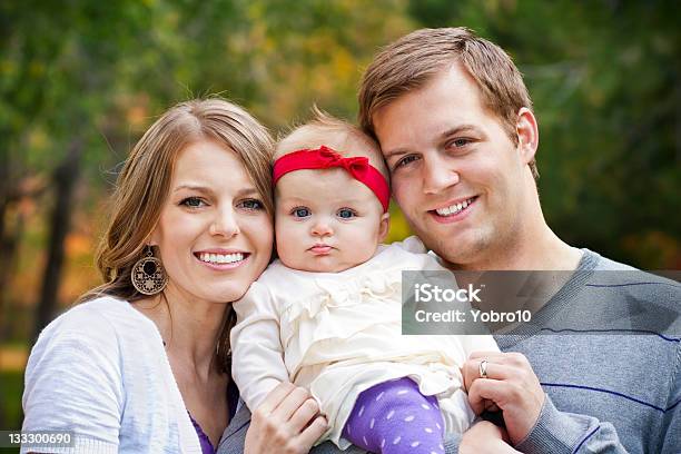 Beautiful Young Family Portrait Stock Photo - Download Image Now - Baby - Human Age, 25-29 Years, 6-11 Months