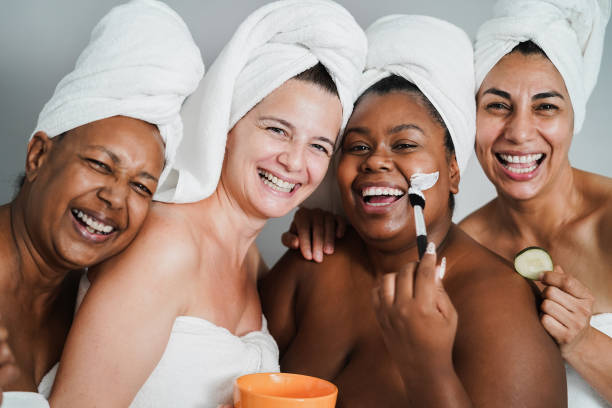 istock Multigenerational women having fun applying face beauty masks on their face - Main focus on caucasian woman face 1333008301