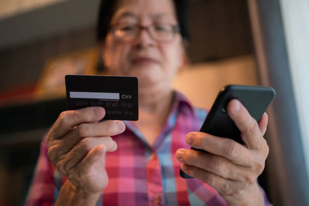 istock Senior asian woman doing online payment . 1333009365