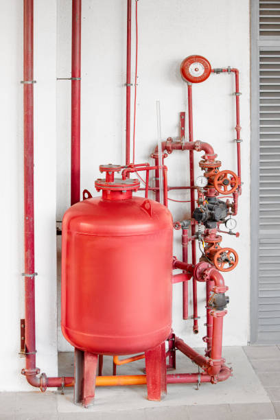 istock Fire extinguishing and fire alarm system with a complex and intricate scheme of pipes, assemblies and a large foam tank 1333011092