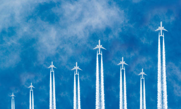 Airplanes in the sky Airplanes flying in parallel in the blue sky forming a stock market curve graph. aerospace industry stock pictures, royalty-free photos & images