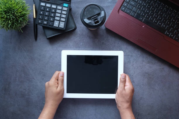 istock top view of businessman using digital tablet on office desk 1333014560