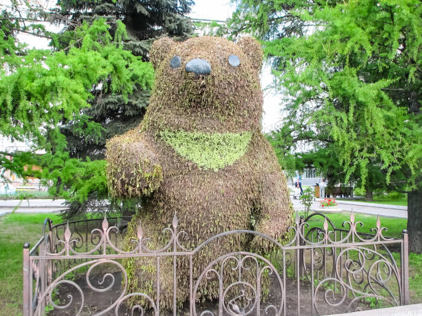 Creative garden design, two rocks with faces, man and woman