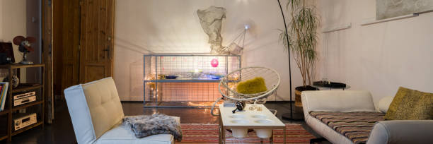 istock Eclectic living room with stylish lighting, panorama 1333017155