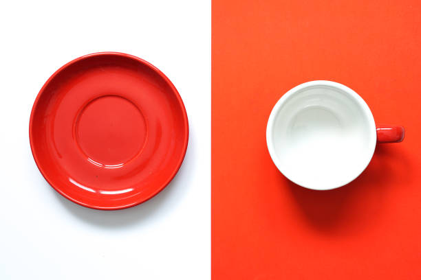 Empty round red ceramic mug and red porcelain.