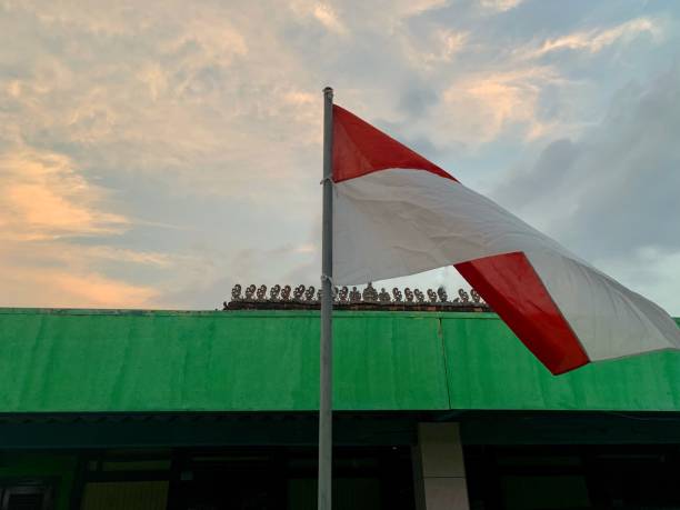 istock Indonesian flag flying high in the sky 1333017772