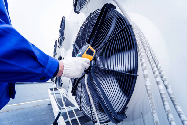 istock Technician uses a thermal imaging infrared thermometer to check the condensing unit heat exchanger. 1333018873