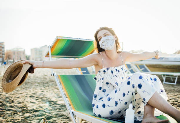 istock Woman in beach chair 1333020691