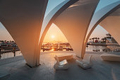 White shell arch with pearls in the new Dubai Creek Marina Harbor. Urban development and travel destinations in UAE