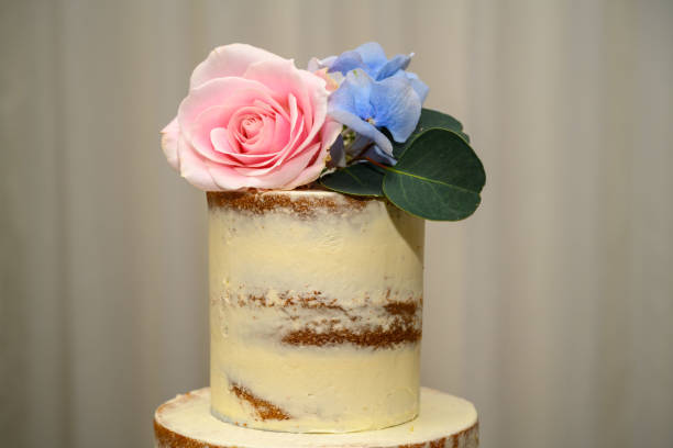 istock Wedding cake decorated with fresh flowers 1333023193