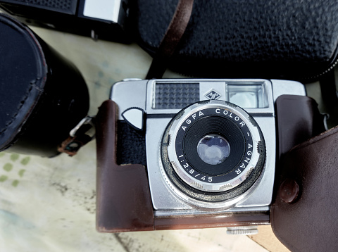 Braunschweig, Germany, August 7, 2021: The antique analog camera of the brand Agfa of the type Color Agnar lies on a table at the flea market