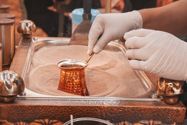 istock Making coffee in a copper cezve coffee maker on hot sand according to a traditional Turkish recipe 1333024792