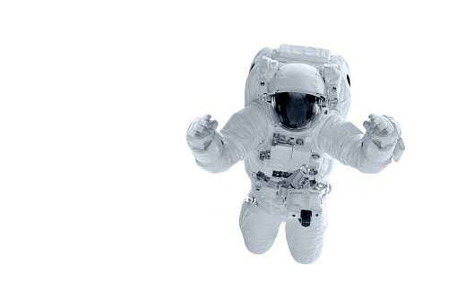 Astronauta en traje espacial vuela sobre un fondo blanco. Se levantan las manos. Elementos de esta imagen proporcionada por la NASA - http://www.nasa.gov/images/content/113238main_image_feature_313_ys_full.jpg photo