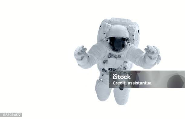 Astronaut In A Spacesuit Flies On A White Background Hands Are Raised Upelements Of This Image Furnished By Nasa Httpwwwnasagovimagescontent113238mainimagefeature313ysfulljpg Stock Photo - Download Image Now